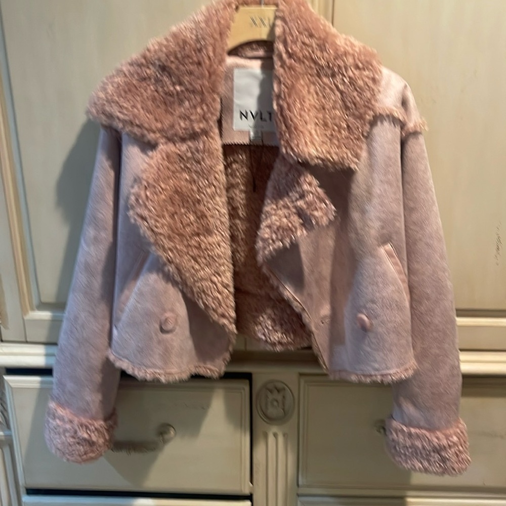 Light pink cropped jacket like new worn a couple of times. Bought at Saks